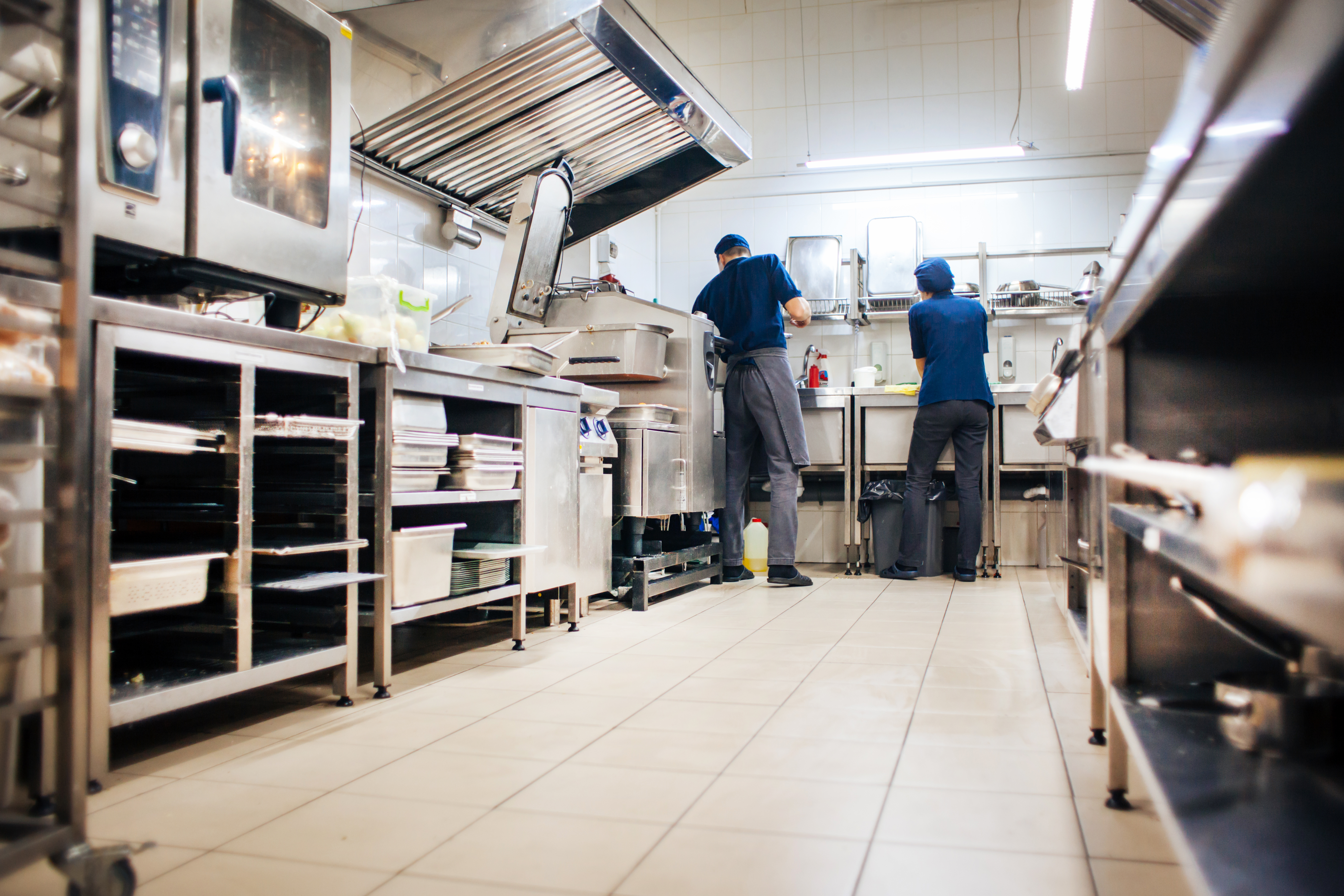 Service technicians in commercial kitchen
